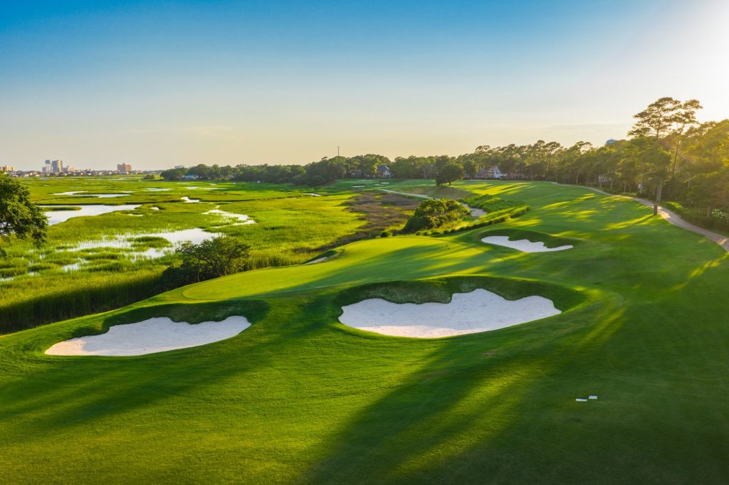 Aerial view of a marsh-side Myrtle Beach golf course at sunrise
